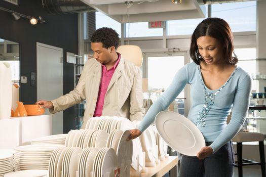 African American couple shopping in a home furnishings retail store.