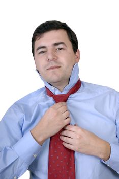 Business man Adjusting His Tie isolated on white