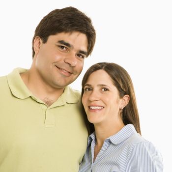 Portrait of smiling couple against white background.