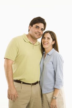 Portrait of smiling couple standing against white background.