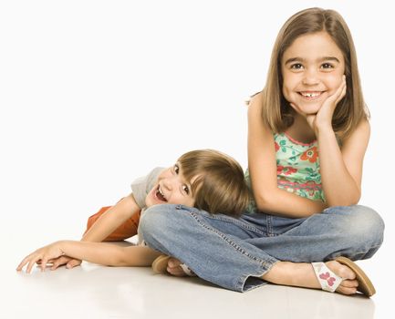 Portrait of girl and boy against white background.