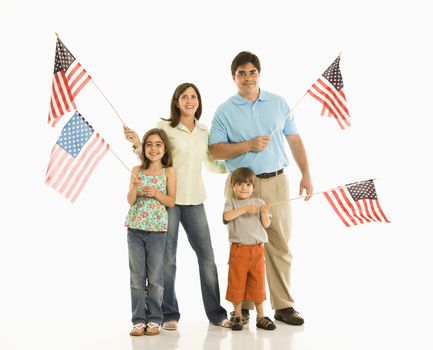Hispanic family holding American flags.