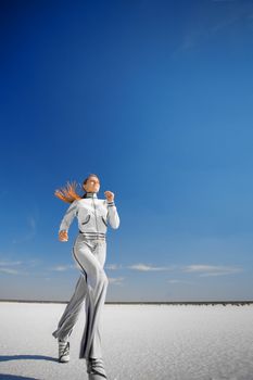 running girl on the white salt land