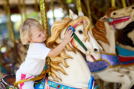 child in park of attractions
