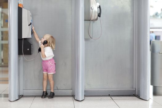 child calling in the airport