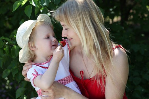 mom and girl with strawberry