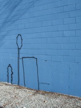graffiti on a blue wall