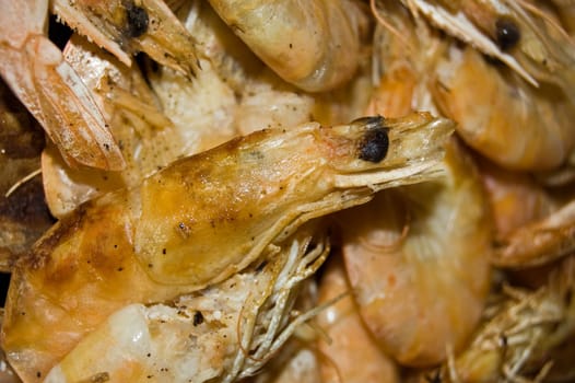 king prawns grilling in a pan