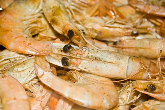 king prawns grilling in a pan