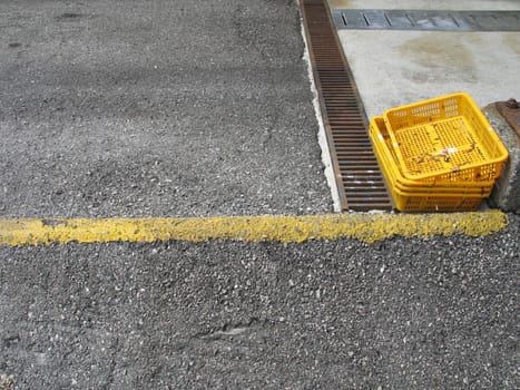 yellow trays in a parking lot