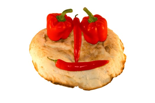 round smiling bread with vegetables over white