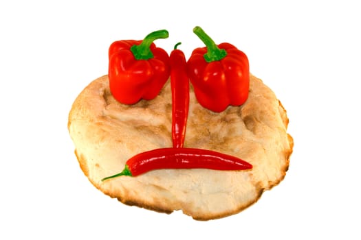 round smiling bread with vegetables over white