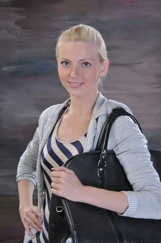 beautiful young woman 20-25 years with road bag