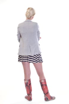 Rear view of a casually dressed young adult woman, isolated on white.