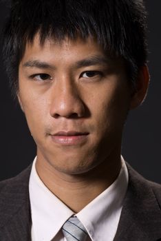 Closeup portrait of Asian young business man.