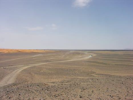 Road going into rocky desert in Morocco