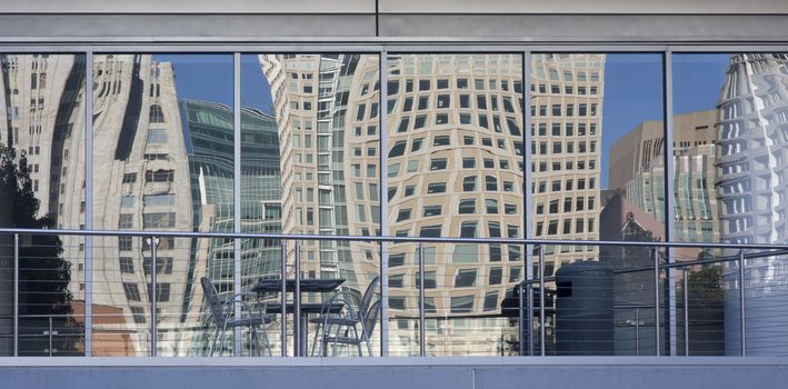 distorted cityscape of San Francisco as reflected by building windows at Yerba Buena Gardens