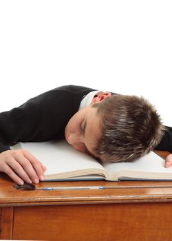 Tired, bored, weary, stressed school student at desk.