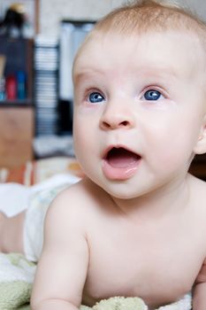 Adorable blue eyed baby looking up