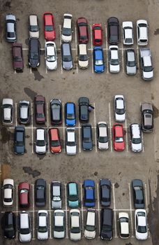 Parking with parked cars. Aerial view from a height.