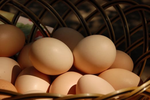 natural organic eggs in basket on table