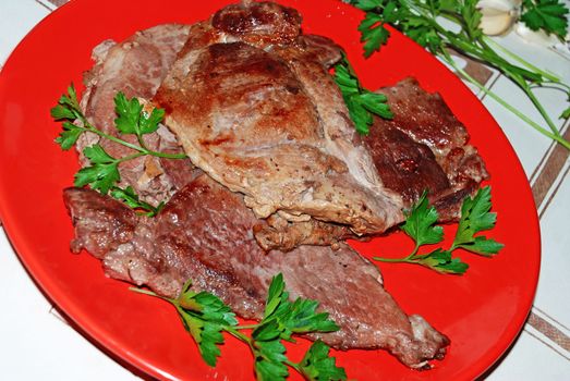 fried mead over red plate served parsley