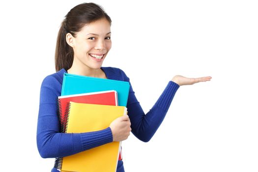 University student holding / presenting something in her hand. Isolated on white.