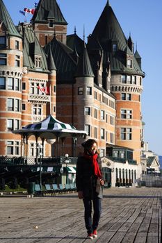 Tourist on Terrasse Dufferin in front of Chateau Frontenac - The most famous landmark in Quebec City.