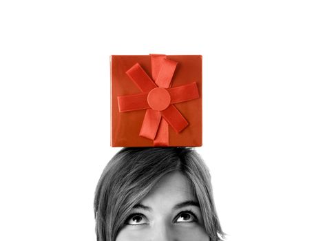 Portrait of a young woman holding a gift isolated on white background - toned in PS