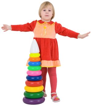 Little girl and toy pyramid on the white background