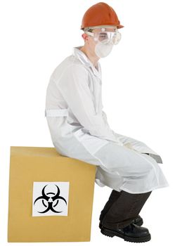 Man in garb scientist sits on box with inscription biohazard