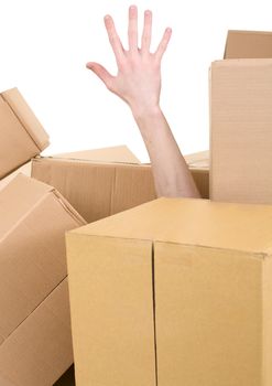 Male hand protruding from pile carton box