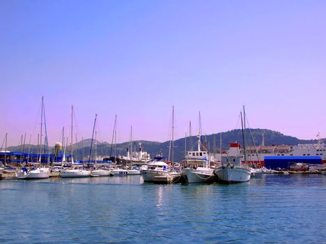 several yachts on tranquil green Adriatic sea water in Montenegro