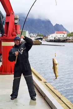 Fisherman on the pier on Lofoten island