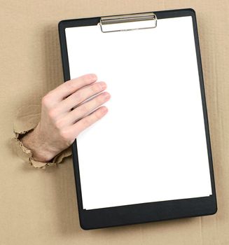 Hand protruding from hole in carton with tablet