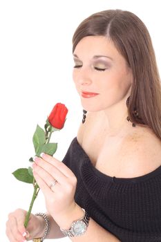 brunette smelling a rose