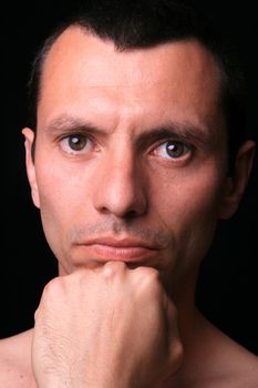 young man over black background