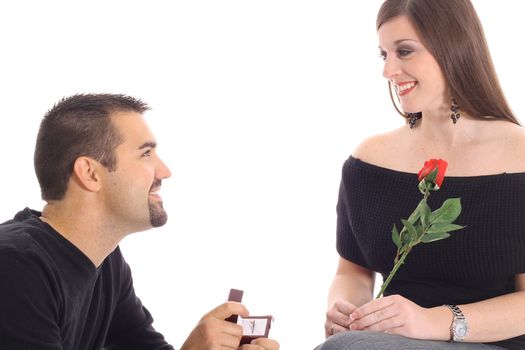 handsome guy proposing with diamond