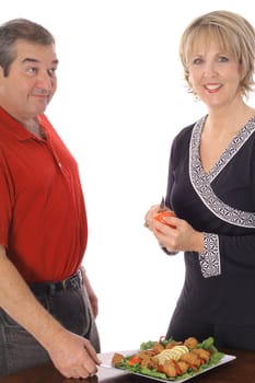 middle age couple with appetizer plate