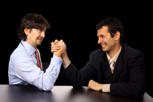 businessmans arm wrestling over white background