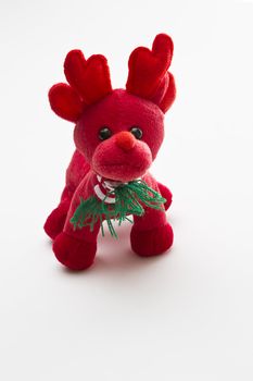 small red reindeer with red and white strip scraf