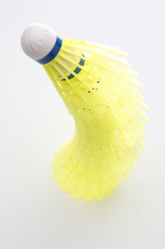 shuttlecock with yellow base stake one on top of the other creating a pyramid