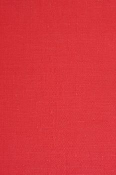 red textile background from 1960s book cover with some stains