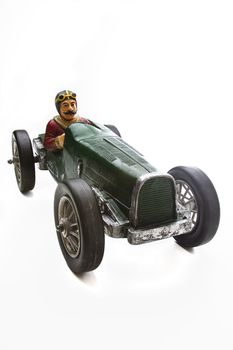 vintage toy race car with mustache driver