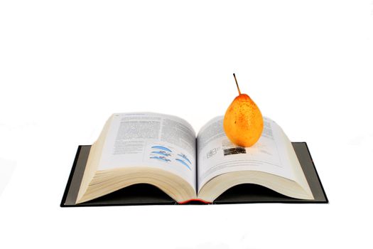 open book and yellow pear isolated over white