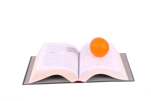 open book and orange isolated over white