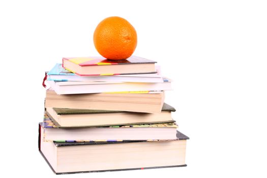 group of books with orange on the top looking like pyramid isolated over white