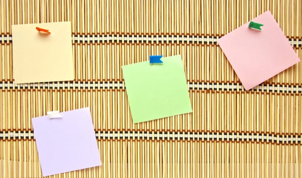 pure colourful papers with tags on straw background