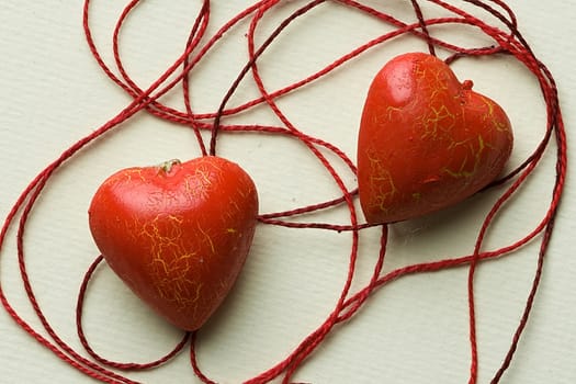 The red heart lie in the thread cobweb