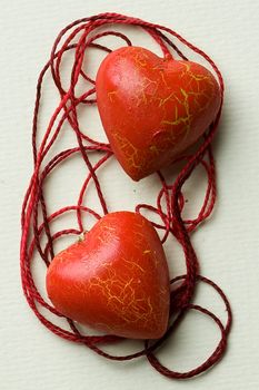 The red heart lie in the thread cobweb